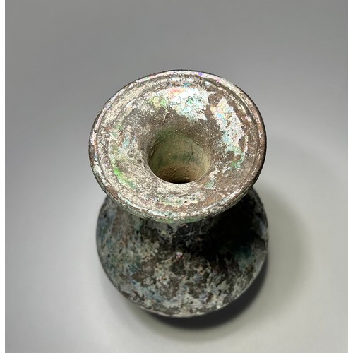 41 - Roman blue cotton reel glass Unguentarium. Circa 2nd-3rd century CE. 101mm x 91mm. Formed of a shall... 