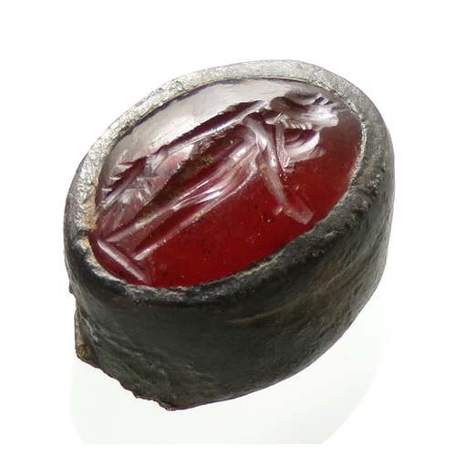 46 - Roman carnelian intaglio set in a silver bezel from a finger ring. The figure can be confidently ide... 