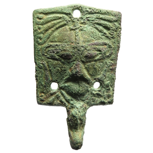 82 - Viking stirrup mount. Circa 10th century CE. An unusual type, detailed with a stylised bearded face,... 