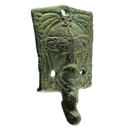 82 - Viking stirrup mount. Circa 10th century CE. An unusual type, detailed with a stylised bearded face,... 