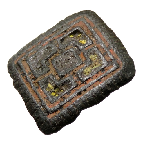 73 - Early Irish geometric enamelled mount. Circa 8th century CE. Formed of a square panel enclosing two ... 