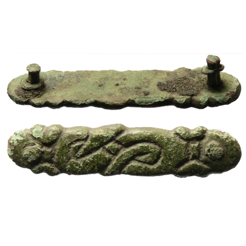 81 - Viking belt mount. A sub-rectangular bronze mount with rounded ends and engraved interlace decoratio... 