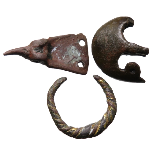 83 - Viking artefacts group (3) to include a scabbard chape, a finger ring and a strap-end, 10th - 11th c... 