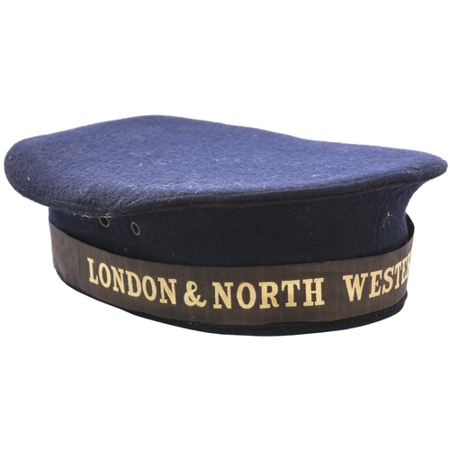 183 - A London and North Western Railway sailor's cap, black felt, silk and leather lining, woven black an... 