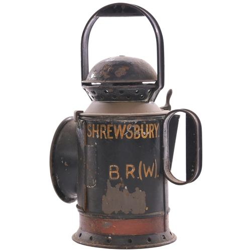 41 - A BR(W), GWR pattern, four aspect brass collared handlamp, the side marked SHREWSBURY, complete and ... 