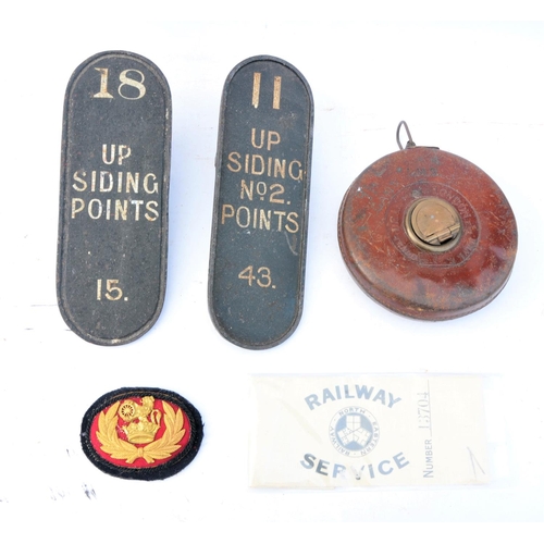 114 - Quantity of misc railway items - lever plates, LMS tape measure, BR(M) Stationmasters cap badge, car... 