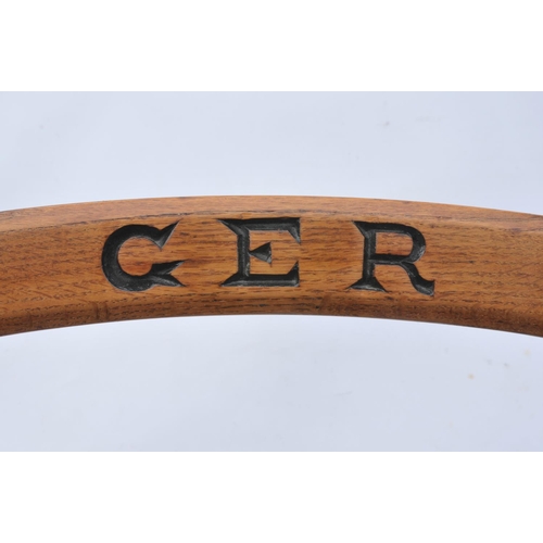 117 - Great Eastern Railway wooden office chair, initials in top rail. (Postage Band: N/A)