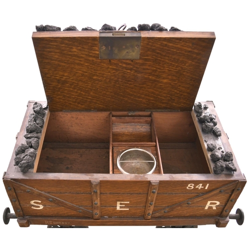 59 - A humidor (tobacco cabinet), in the form of a South Eastern Railway coal wagon. Overall length 13