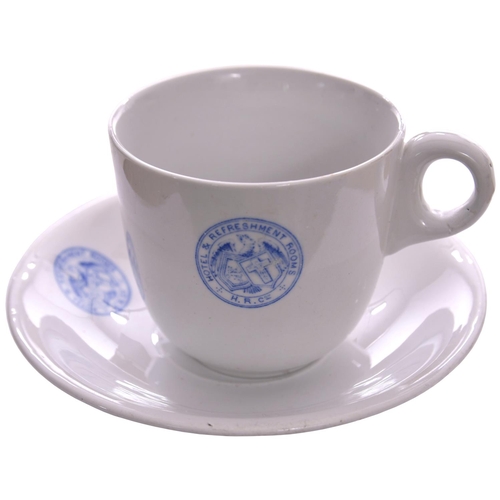 139 - A Highland Railway tea cup and saucer, by Johnson Bros, each marked with the company coat of arms in... 