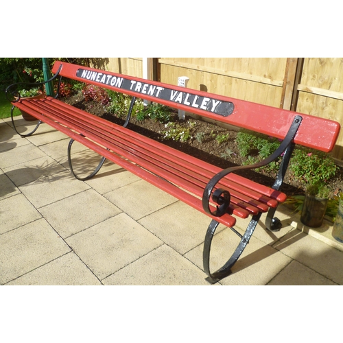 107 - An LNWR platform seat, NUNEATON TRENT VALLEY, wooden slats, wrought iron supports, the top bar with ... 