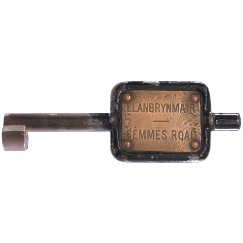 22 - A single line key token, LLANBRYNMAIR-CEMMES ROAD, (older straight shank cast steel/engraved brass),... 