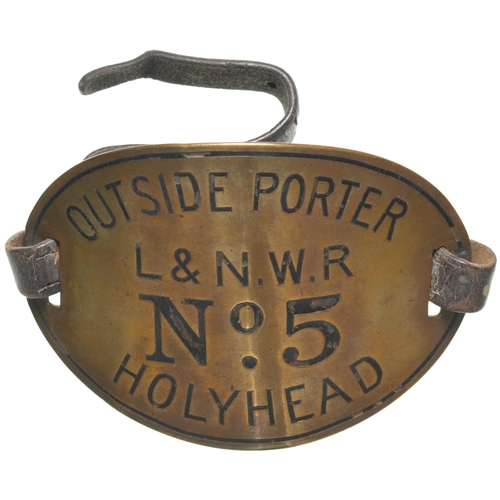 46 - An armband, OUTSIDE PORTER, LNWR, No 5, HOLYHEAD. Engraved brass, 5½