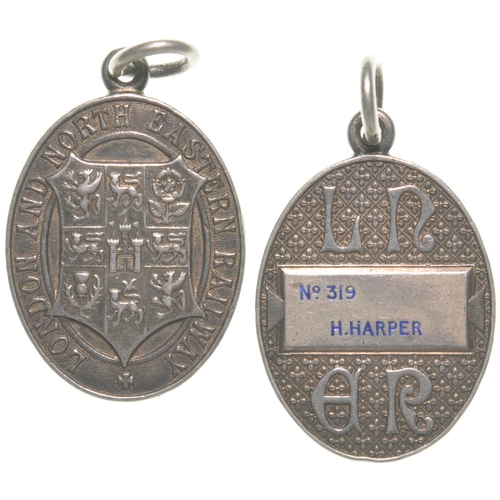 154 - An LNER directors free pass, with coat of arms and stylised initials, H Harper. Silver, 1