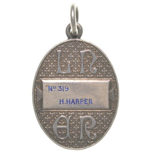 154 - An LNER directors free pass, with coat of arms and stylised initials, H Harper. Silver, 1