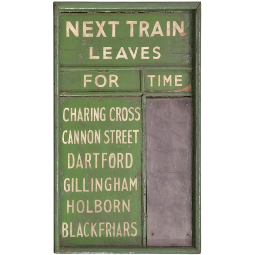 21 - A train information board, NEXT TRAIN LEAVES FOR CHARING CROSS, CANNON STREET, DARTFORD, GILLINGHAM,... 