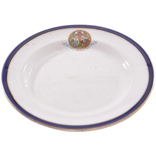 297 - A North Eastern Railway Hotels Dept tea plate, by Booths, with blue and gilt rim and multicoloured N... 