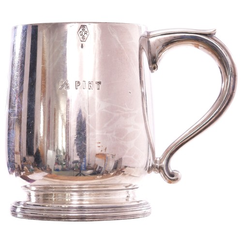 282 - A North Eastern Railway pint tankard by Elkington with belted garter, N.E.R. REFRESHMENT ROOMS, BRID... 