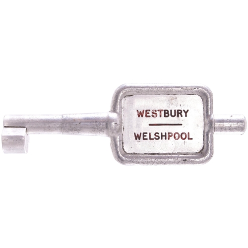 105 - A single line key token, WESTBURY-WELSHPOOL, (alloy), from the Shrewsbury to Welshpool route. (Posta... 