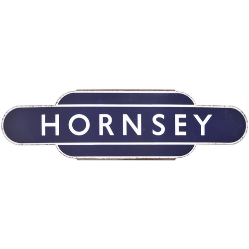 142 - A BR(E) totem sign, HORNSEY, from the southern end of the East Coast Main Line, the station situated... 