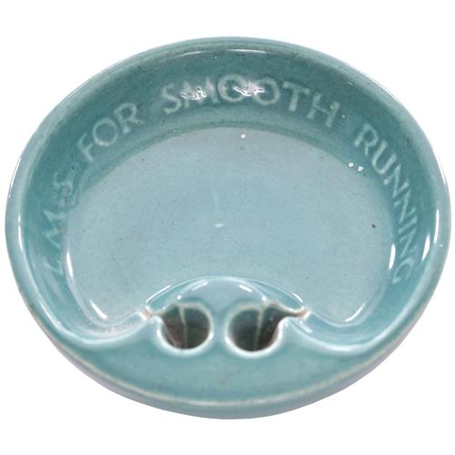 346 - A circular ashtray, LMS, FOR SMOOTH RUNNING, by Ashmead Potters, triangular, china, 4¼