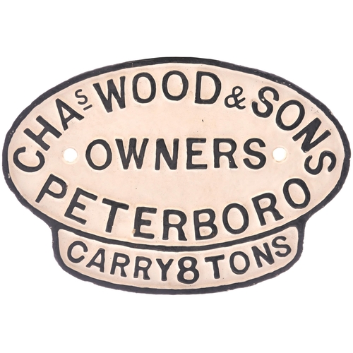 426 - A wagonplate, CHAS WOOD & SONS OWNERS PETERBORO, CARRY 8 TONS. Cast iron, 10¾