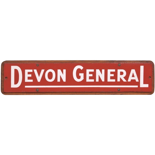 413 - A poster board header, DEVON GENERAL, as used at railway stations, displayed above the local bus tim... 