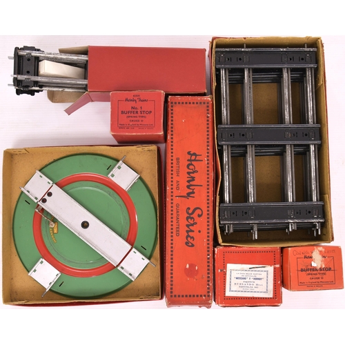 252 - Hornby '0' gauge. 2 set boxes containing clockwork track. 3 boxed No 2 clockwork turntables. 1 boxed... 