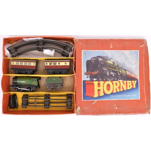 354 - Hornby '0' gauge. Post-war Hornby passenger set No 31. BR green loco and tender, clockwork + 2 blood... 