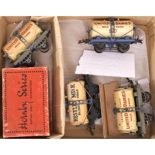 75 - Hornby '0' gauge milk tankers, one boxed United Dairies, two other United Dairies, plus one Nestles ... 