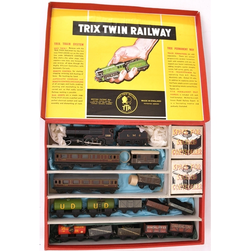 96 - Trix Twin Railway, 3-rail electric LMS 4-4-0 loco and tender.  Black No 1168 + LMS black tender with... 