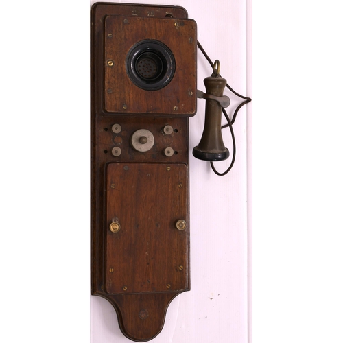 958 - Signal box telephone, with fixed mouthpiece and trumpet earpiece, on shaped backboard, overall heigh... 