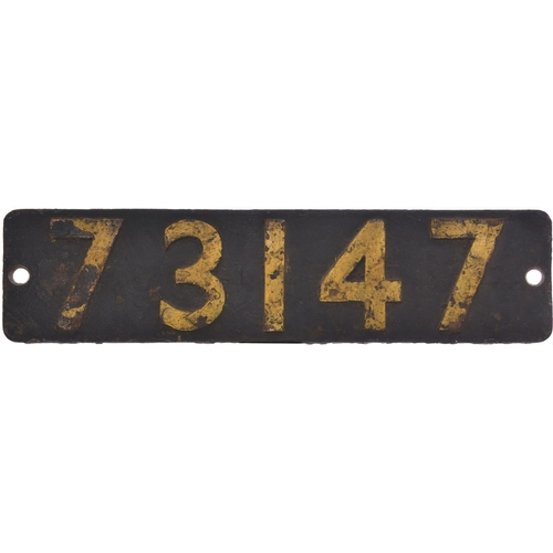 A smokebox numberplate, 73147, from a BR Standard Class 5 4-6-0 built at Derby, one of the class fitted with Caprotti valve gear. It was allocated new in February 1957 to St Rollox where it spent all its working life mainly used on expresses from Glasgow Buchanan Street to Dundee and Aberdeen. Withdrawn in August 1965, it was sold for scrap to Motherwell Machinery & Scrap at Wishaw. Ex loco condition with crusty yellow paint to the numbers. (Postage Band: D)