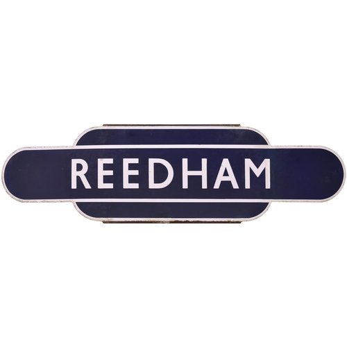 A BR(E) totem sign, REEDHAM, (h/f), from the Norwich to Lowestoft Central / Yarmouth route. Excellent colour and shine, three tiny chips on the lettering and a right-hand crease repair affecting the right side of the letter 'M'. (Postage Band: D)