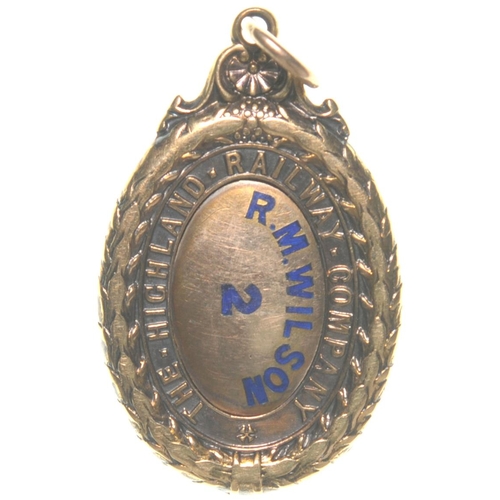 413 - A Highland Railway director's pass, R M WILSON, 2, gold with blue enamel inlay, a decorative floral ... 