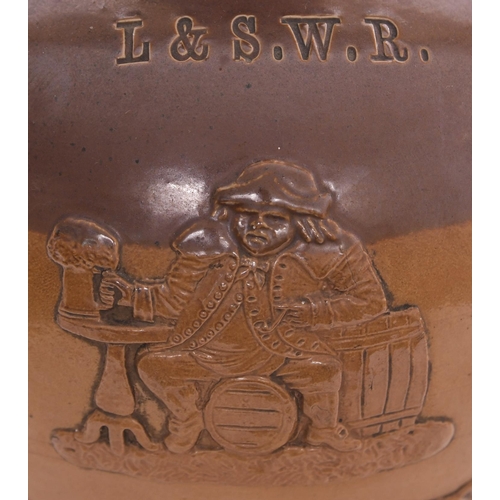 461 - A London and South Western Railway serving jug for beer, the side decorated with scenes of drinking ... 