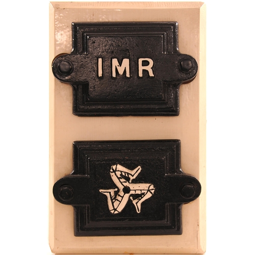 1119 - Isle of Man Railway axle box covers, IMR and Legs of Man, repainted. (2)