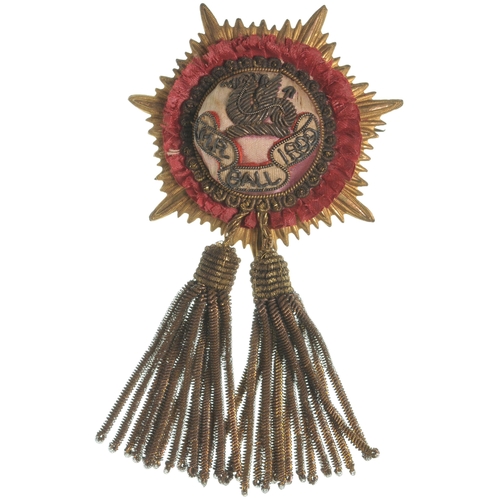 142 - A Midland Railway Annual Ball 1899 badge, a brass sunburst with crimson silk centre, gilt wire wyver... 