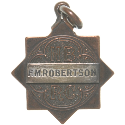 247 - A North British Railway director's pass to F M Robertson, brass, 1 1/8