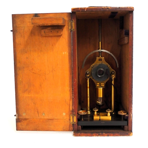 100 - Scientific instrument in wooden case, has 