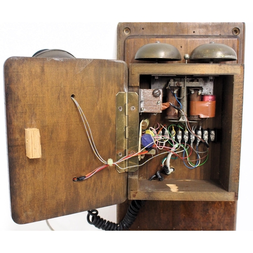 88 - Wall mounted wooden dial telephone with writing slope, appears to have been updated regarding wiring... 