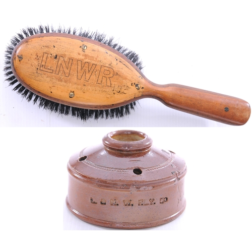 1094 - LNWR landmine inkwell, two base chips, also a clothes brush, LNWR initials inlaid on top and stamped... 