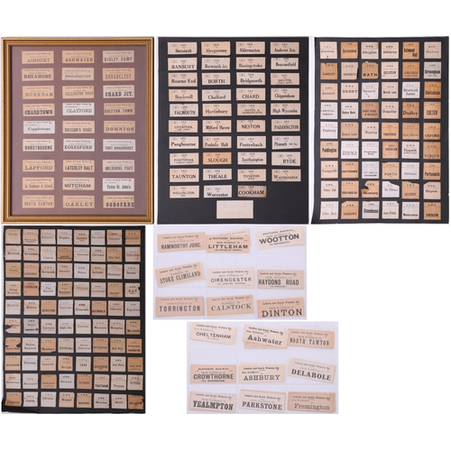 1097 - Mounted luggage labels, a frame containing 27 LSWR labels, three black sheets of GWR labels laid dow... 