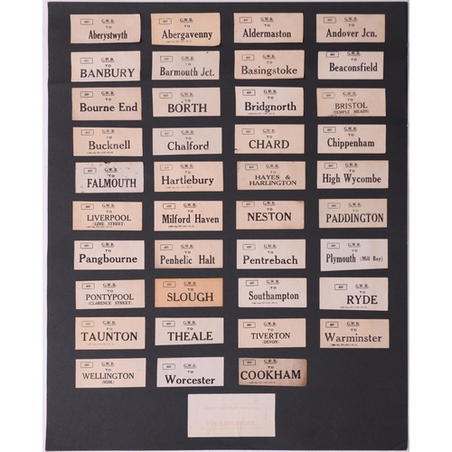 1097 - Mounted luggage labels, a frame containing 27 LSWR labels, three black sheets of GWR labels laid dow... 