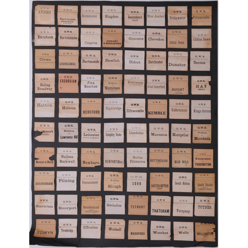 1097 - Mounted luggage labels, a frame containing 27 LSWR labels, three black sheets of GWR labels laid dow... 