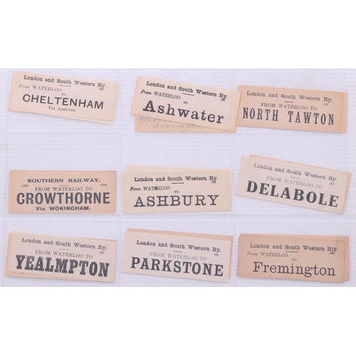 1097 - Mounted luggage labels, a frame containing 27 LSWR labels, three black sheets of GWR labels laid dow... 