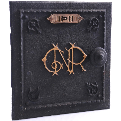 1130 - GNR stove door, with decorative company monogram and brass fittings, cast iron, 13½