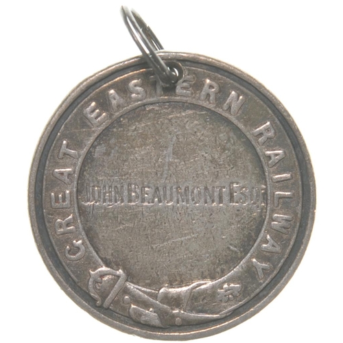 243 - A Great Eastern Railway director's pass, John  Beaumont, silver, with coat of arms and belted garter... 