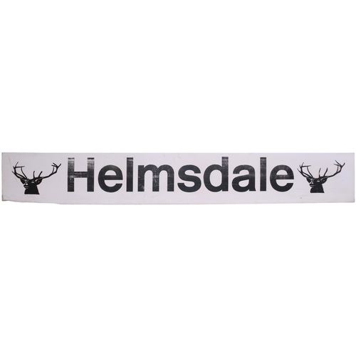 272 - A BR station sign, HELMSDALE, with stags head emblem at each end, plastic, 83