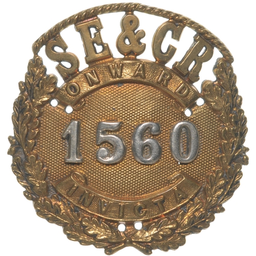 373 - A South Eastern and Chatham Railway Guard's cap badge, an ornate design bearing the mottos Onwards a... 