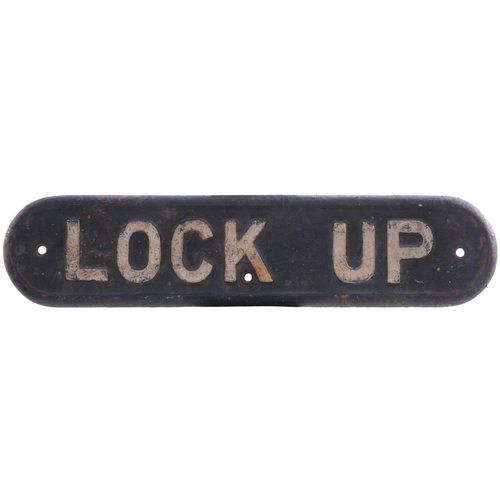 87 - An LNER doorplate, LOCK UP, cast iron, length 16